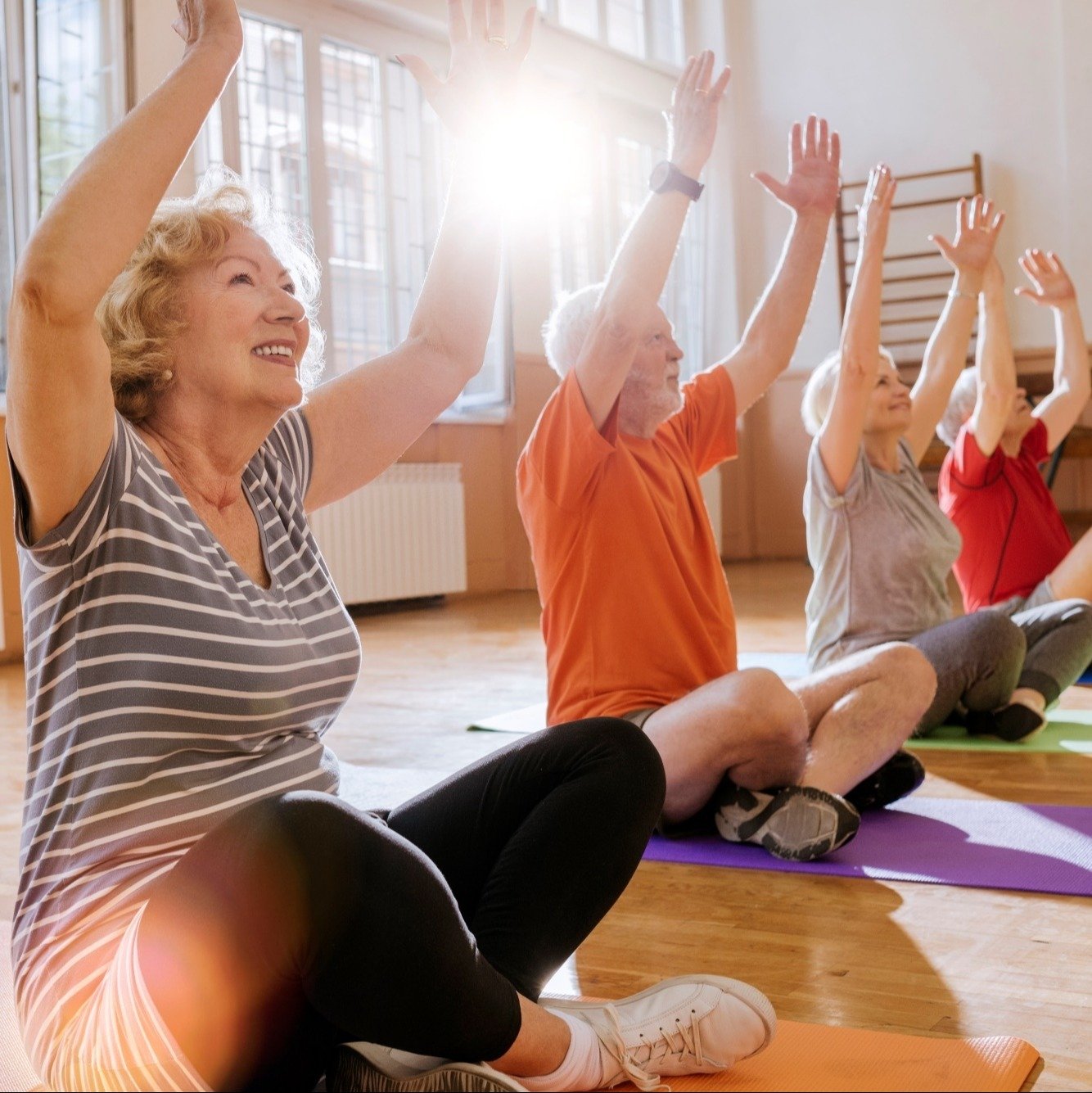 Seniors doing yoga group