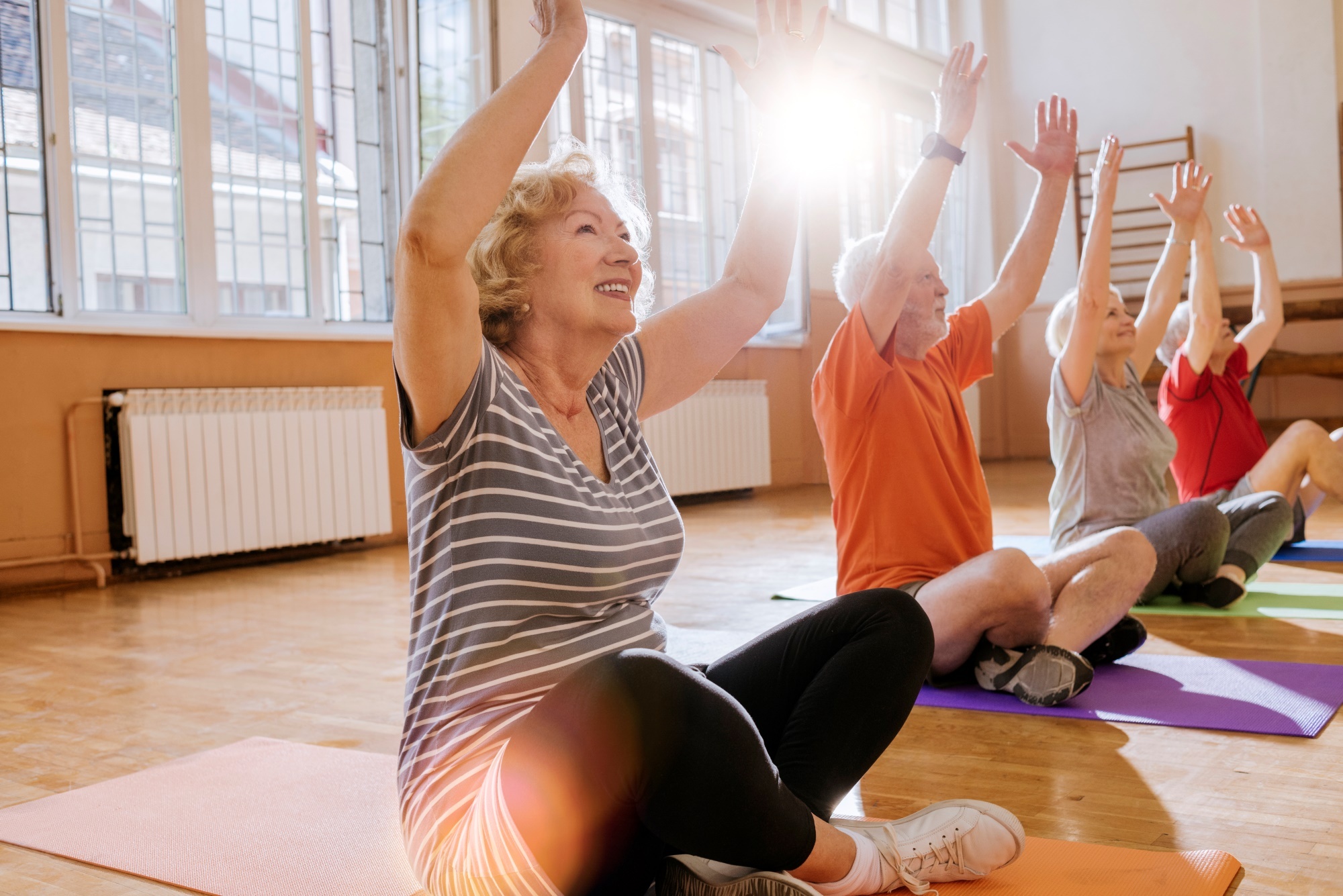 Seniors doing yoga group