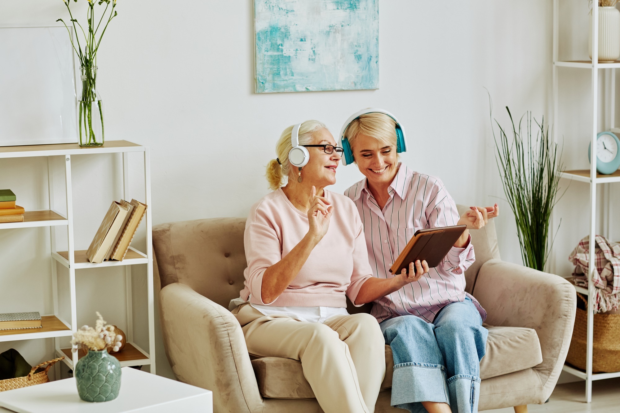 woman and younger woman listening to music
